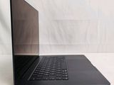 an open laptop computer sitting on top of a white surface