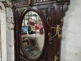 a mirror sitting on a shelf in a room