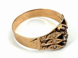 an image of a gold ring with garnets and pearls on it