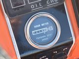 a close up of a dashboard with a clock on it