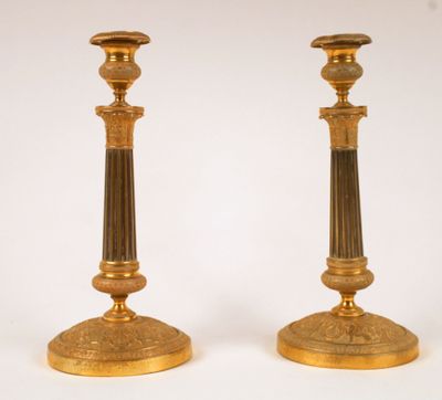 pair of antique brass candlesticks with fluted bases