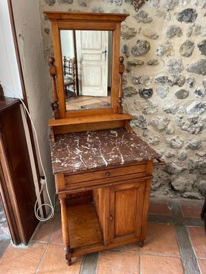 a wooden vanity with a marble top and a mirror