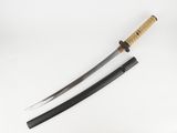 a close up of a knife with a wooden handle on a white surface