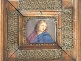 painting of a woman in a blue dress in a wooden frame