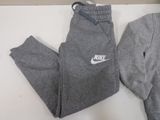 grey sweat pants with white nike logo on the side