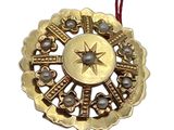gold plated christmas ornament with a star on top of it