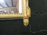 a mirror hanging on the wall in a room
