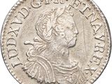 une pièce d'argent sur laquelle figure l'effigie d'une femme coiffée d'une couronne