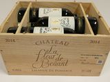 bottles of wine in a wooden box on a table