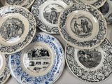 a lot of plates that are sitting on a table