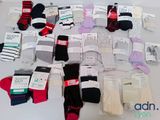 several pairs of men ' s socks are laid out on a table