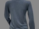 the back of a mannequin wearing a blue sweater and black pants