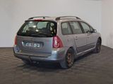 a silver car parked in a room with a checkered floor
