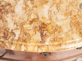 a marble table with a metal base and a marble top
