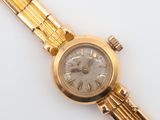 an image of a close up of a wrist watch on a white surface