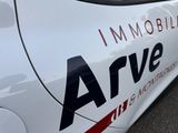 a close up of a white car with the word arve on it