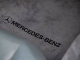 the mercedes logo is seen on the floor of a car