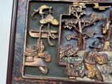 a picture of a wooden plaque with a picture of a man and a woman