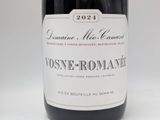 a bottle of wine that is sitting on a table