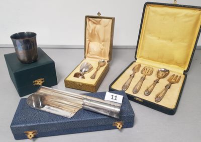 several silverware items are sitting in a case on a table