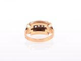 a close up of a gold ring with diamonds on it