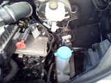 a picture of a car engine with its hood open
