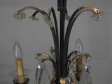 a chandelier that has a lot of glass hanging from it