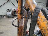 an image of a fork in a warehouse with other equipment