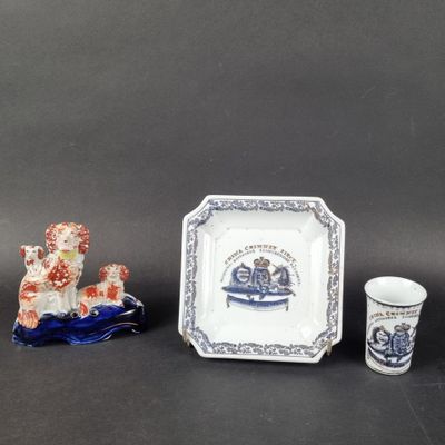 three pieces of blue and white pottery including a plate, cup, and saucer