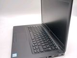 a laptop computer sitting on a table with a white background