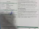 a document with a picture of a person holding a cell phone