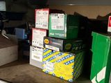 many boxes on a shelf in a room