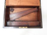 a wooden box that has some pieces of wood in it