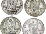 four different types of silver coins on a white background