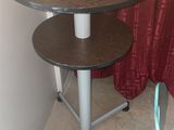 a small table with a laptop on top of it