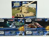 several star wars toys are stacked on top of each other