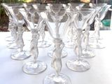 many wine glasses sitting on a table outside