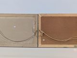 two pieces of cardboard with a picture frame attached to it