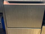 an image of a stainless steel dishwasher sitting on top of a wooden floor