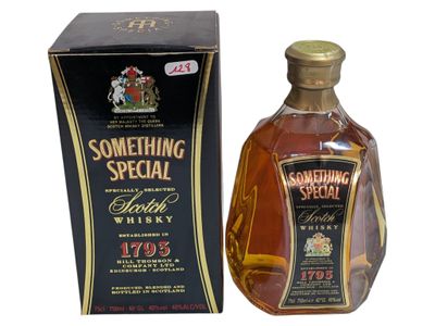 an image of a bottle of something special scotch whisky in front of a box