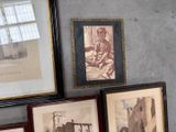 three framed pictures on the wall of a room