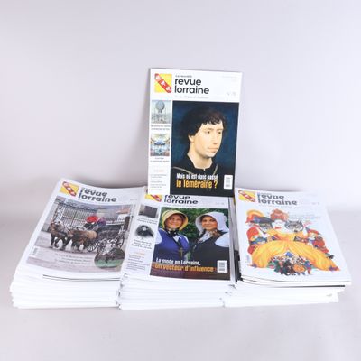 a lot of magazines that are stacked on top of each other