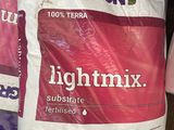 two bags of lightmix sit on a shelf in a store