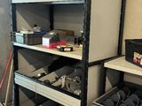 many shelves that have various items on them in the room