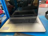 two laptops that are sitting on a blue table