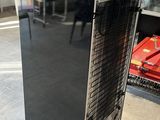 an image of a black refrigerator in a kitchen