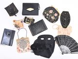 many different purses and handbags laid out on a white surface