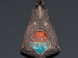 an image of a silver pendant with a red and blue design