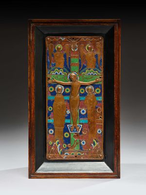 a wooden plaque depicting a man on a cross with flowers