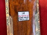 a picture of a wooden door with a sign on it